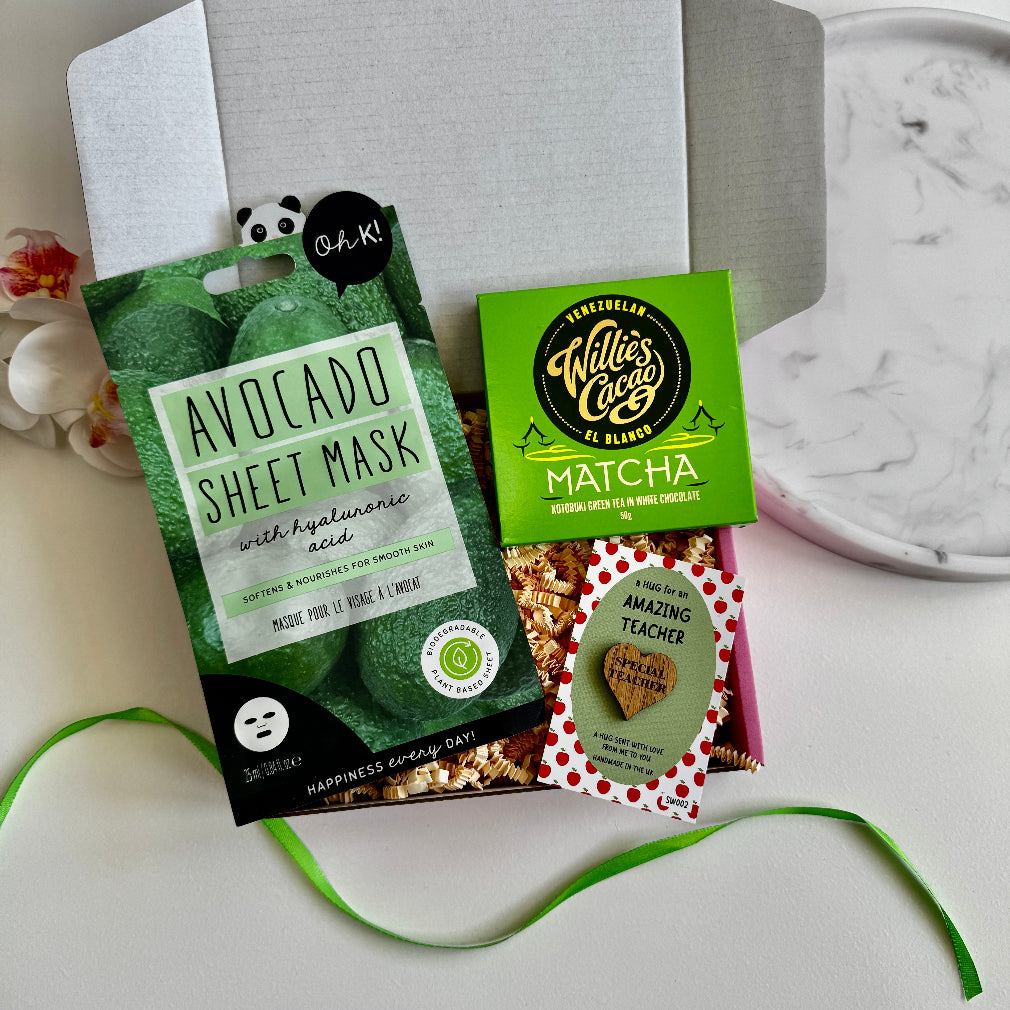 Teacher gift box with avocado face mask, matcha white chocolate, and wooden “Amazing Teacher” keepsake token.