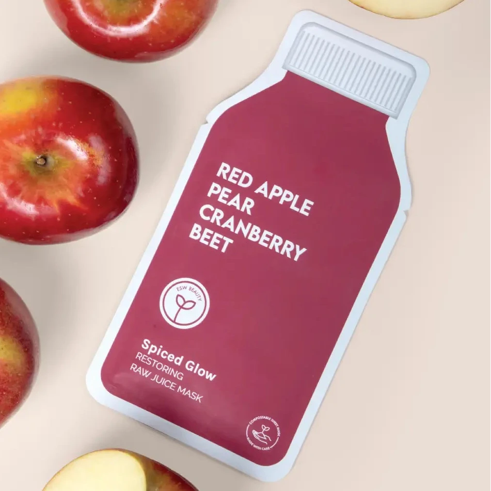Red apple pear cranberry beet mask packaging with apples on a beige background
