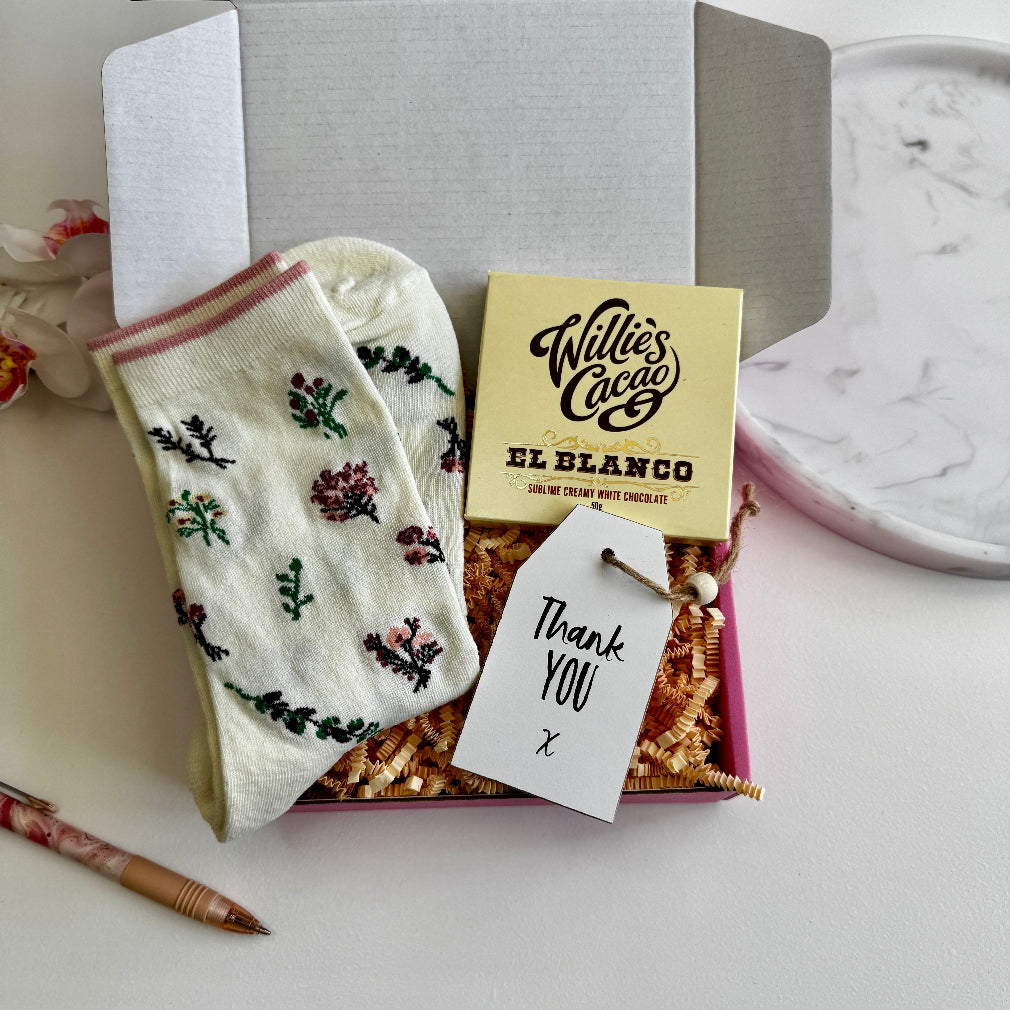 Mini thank you gift box with floral socks, white chocolate bar, and a handwritten thank you tag – perfect for teachers or friends.