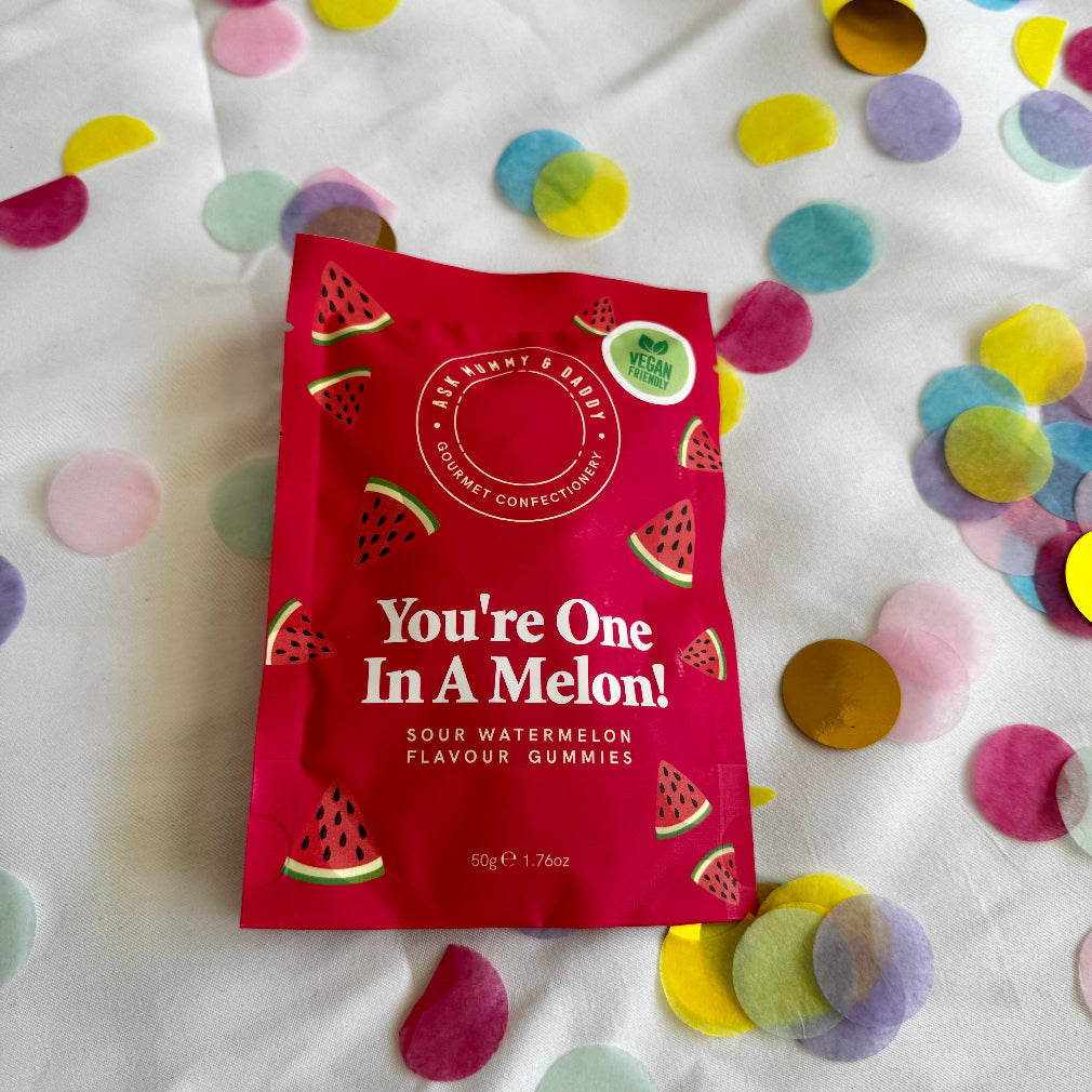 Sour watermelon gummies in a red pouch with watermelons on it