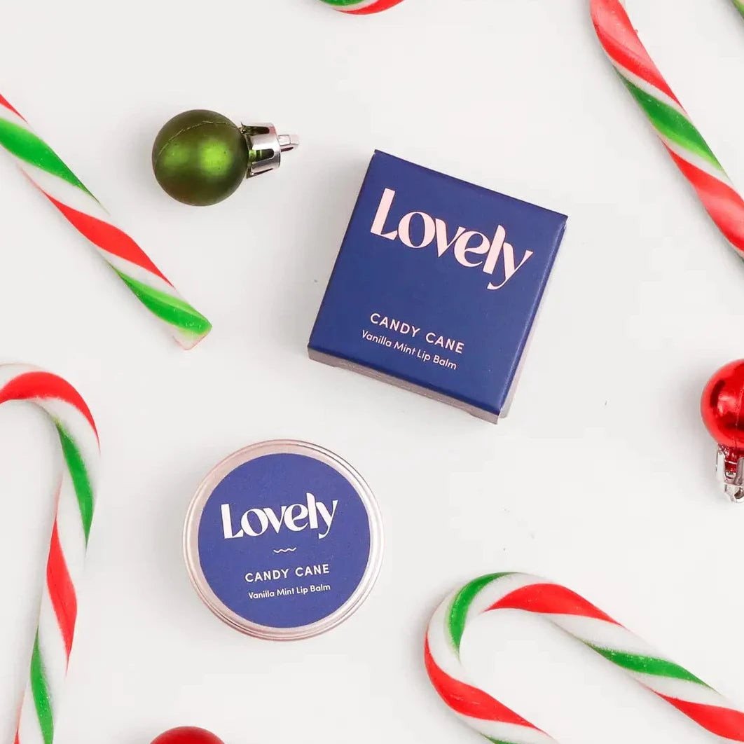 Candy canes, ornaments, and a 'Lovely' product on a white background