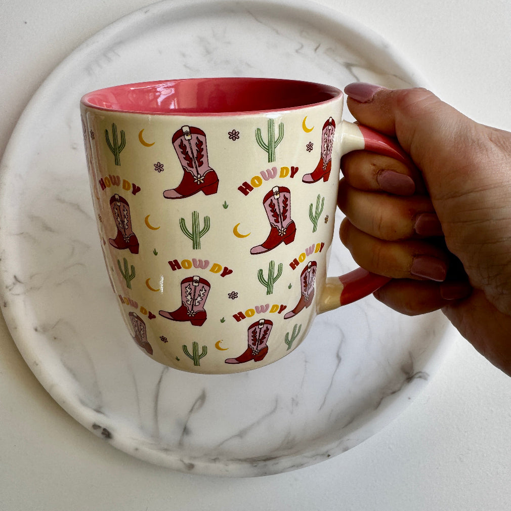 cream Howdy Cowboy Boot Print Mug. pink on the inside