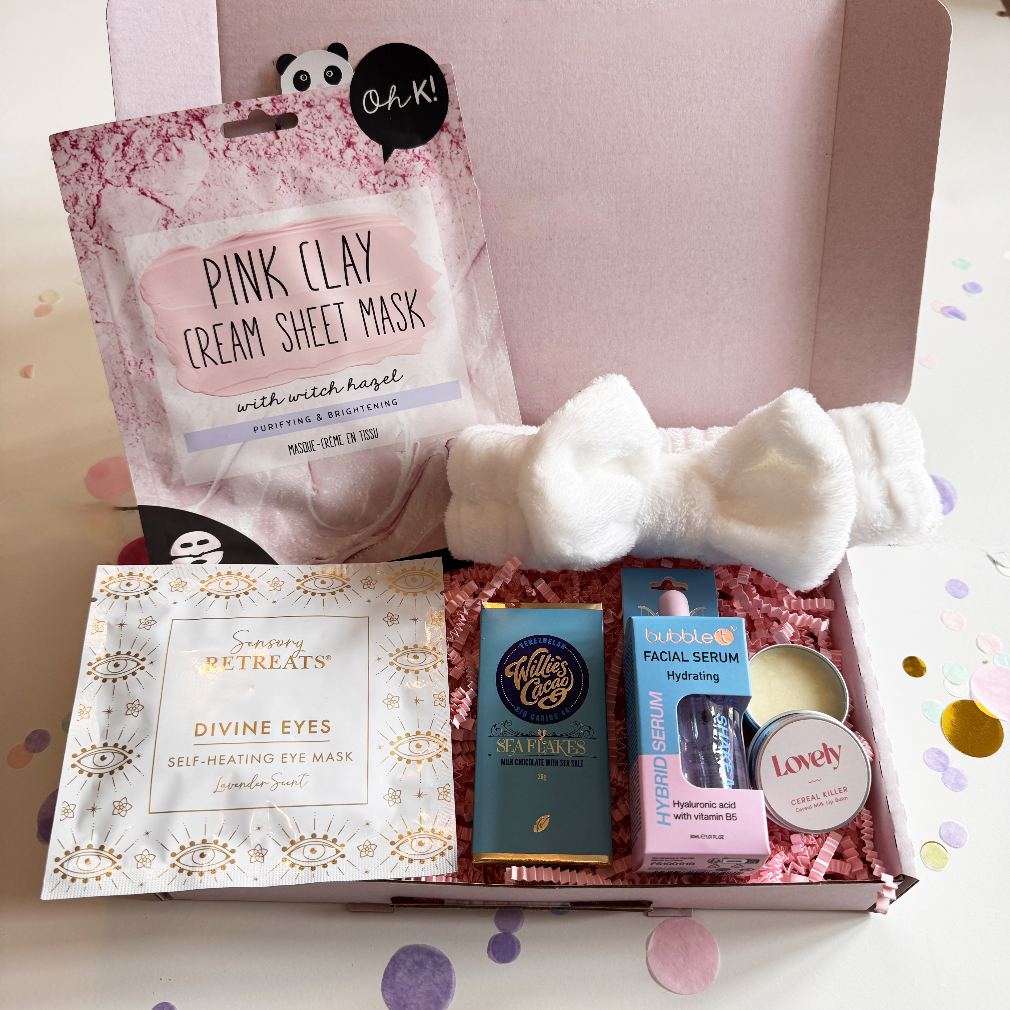 Cosmetic gift set with pink clay cream sheet mask, eye mask, and other skincare products in a box.