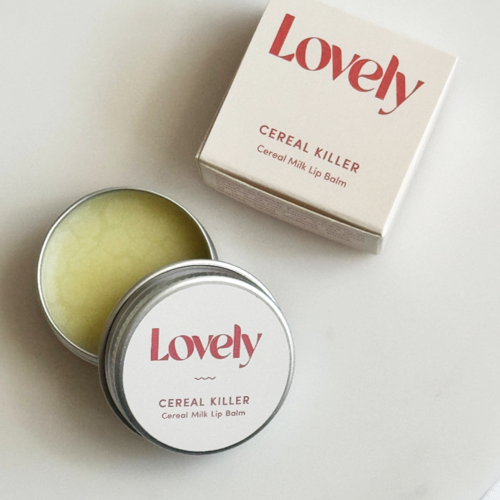 Lip balm with 'Lovely' branding on a light background