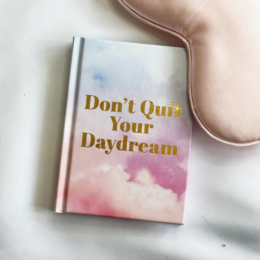 a pastel pink and blue hardback book with inspirational quotes