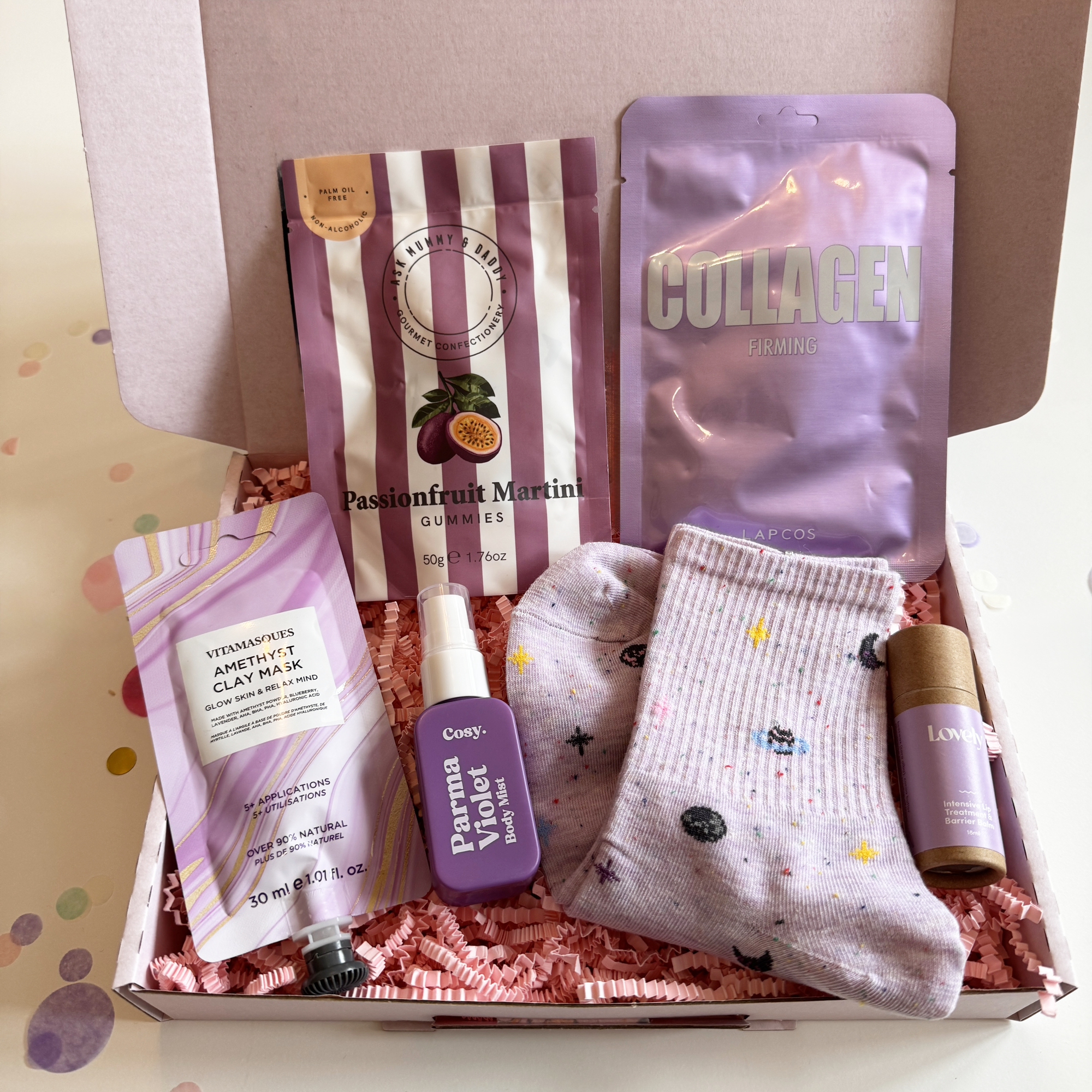 Assorted items including a sock, skincare products, and a collagen package in a box.