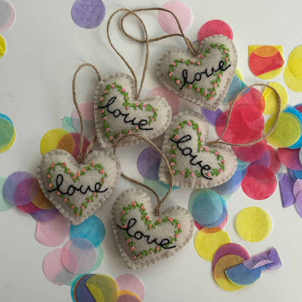 Handmade Love cushion handing keepsake. sewed with delicate flowers