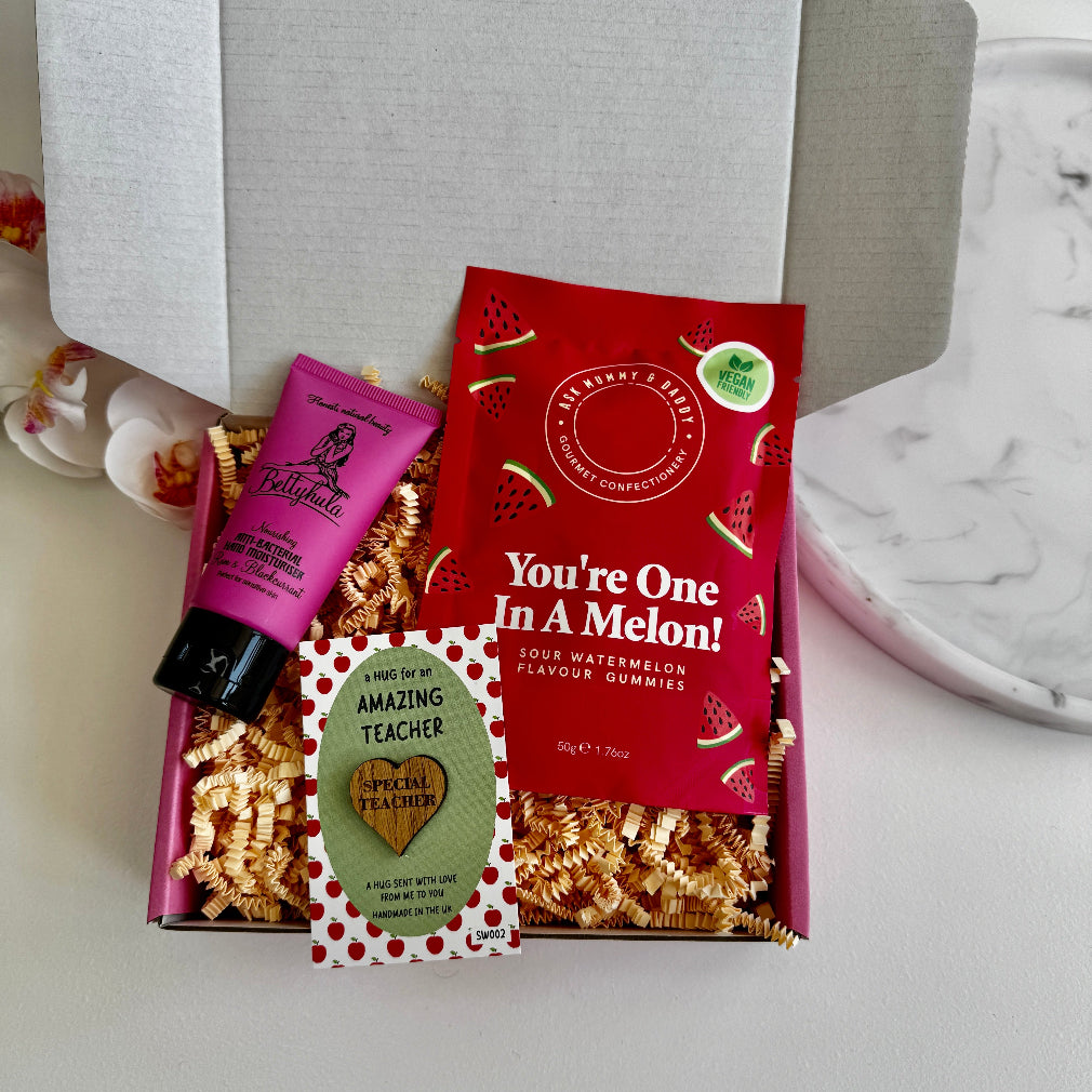 Teacher gift box with sour watermelon sweets, hand cream, and “Amazing Teacher” wooden heart keepsake.