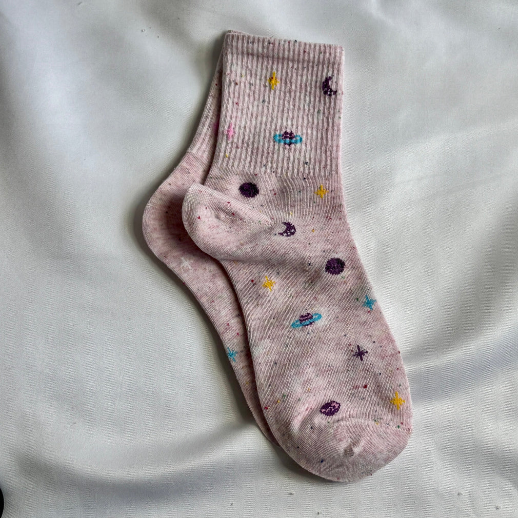 pink socks with a galaxy pattern