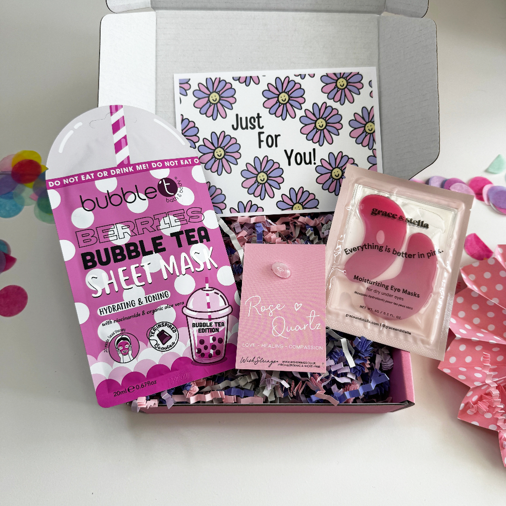 Pink bubble tea sheep mask packaging with decorative elements on a white background