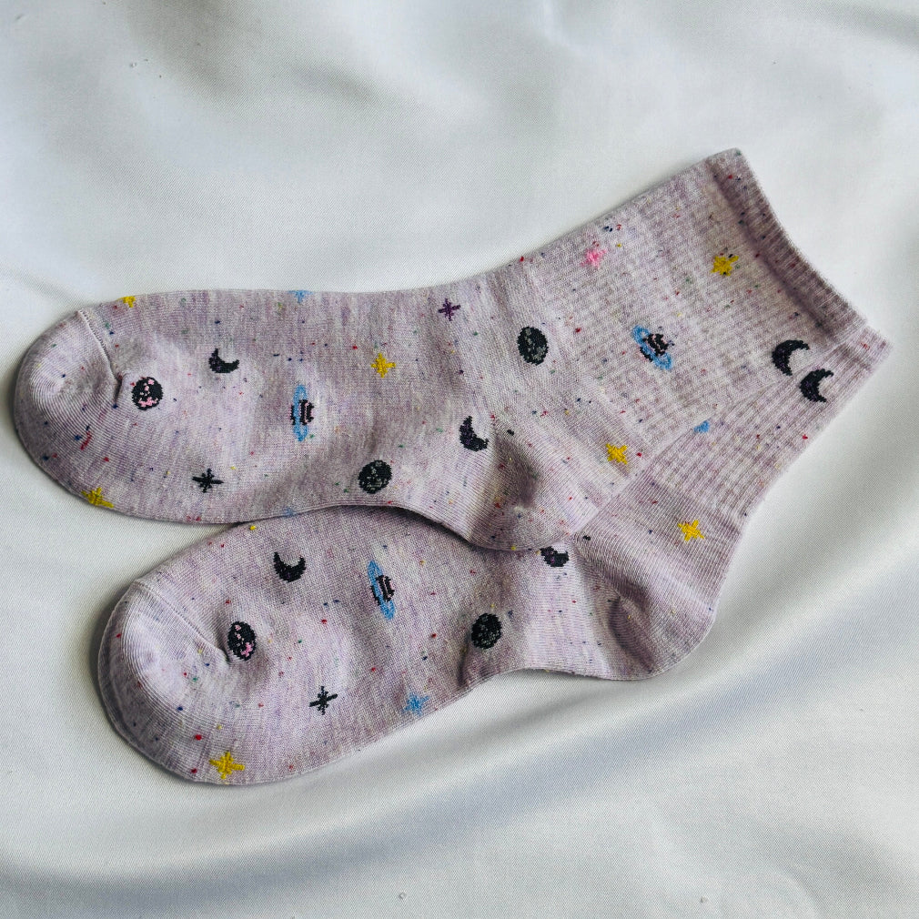 purple socks with a galaxy pattern