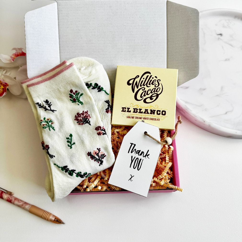 Mini thank you gift box with floral socks, white chocolate bar, and a handwritten thank you tag – perfect for teachers or friends.