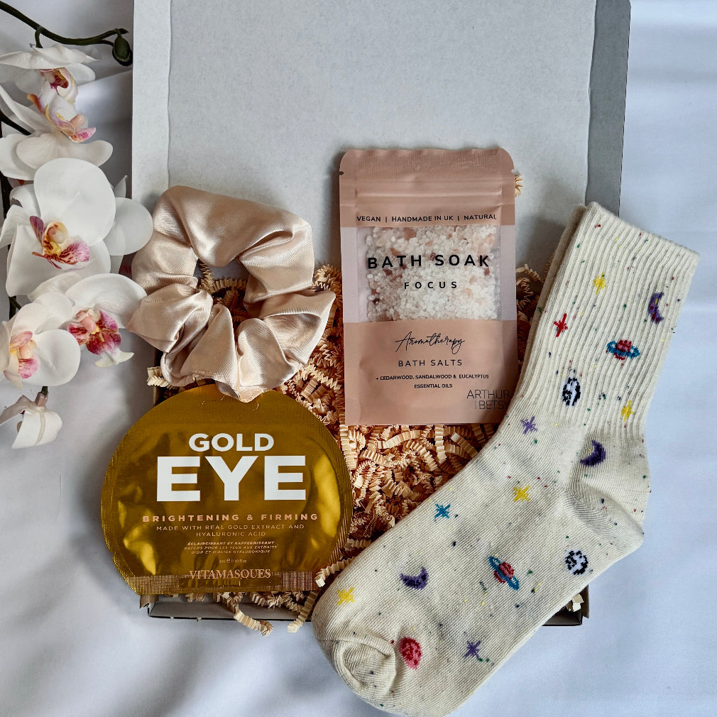 treatbox including skincare, edible treats and keepsakes with a themed note card