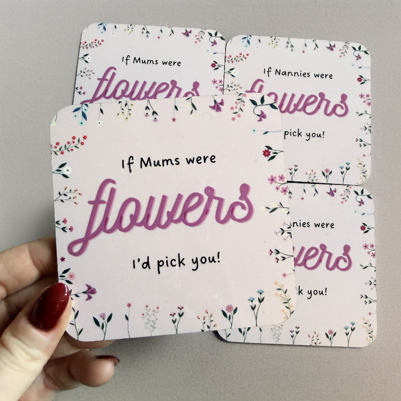Floral card with text 'If Mums were flowers, I'd pick you!' held by a hand.