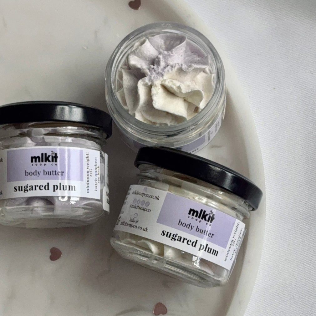 whipped body butter with a plum scent. in a glass jab and the butter is purple and white colour