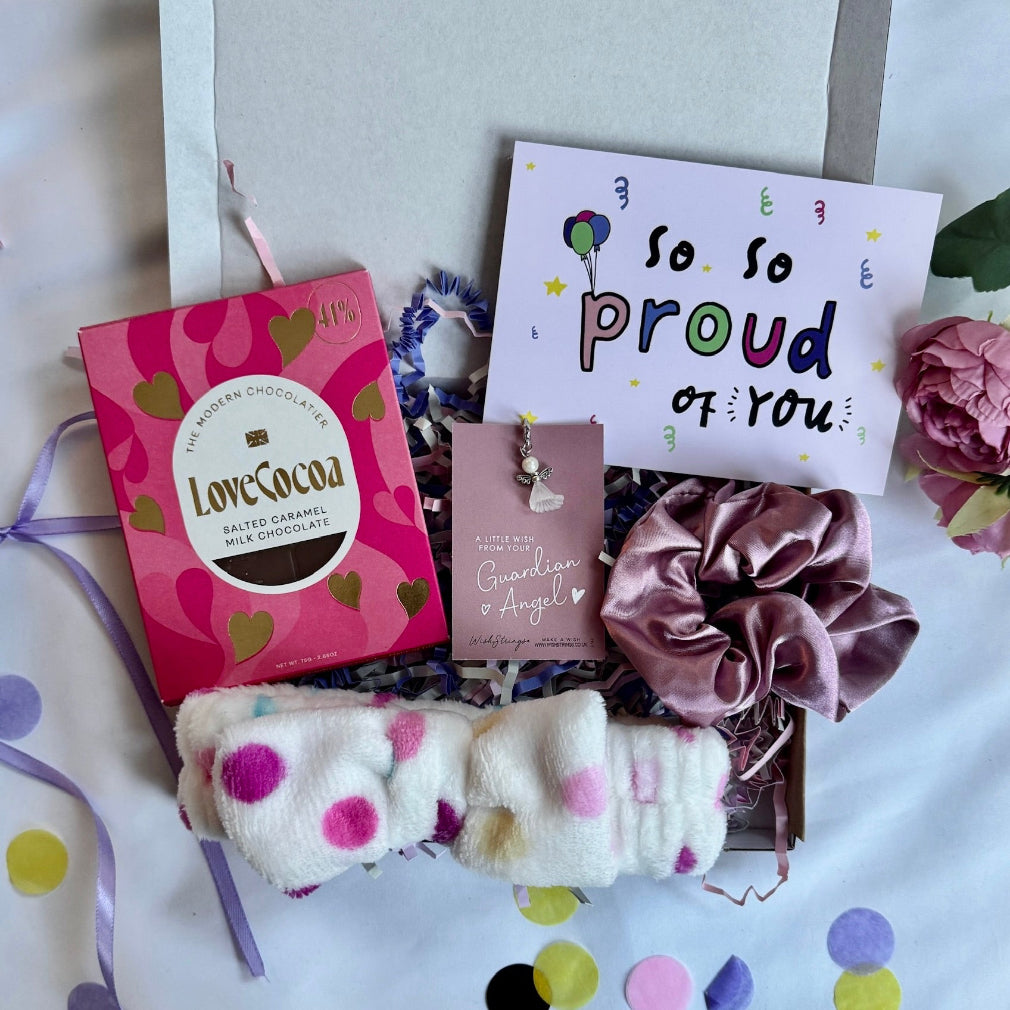 treatbox including skincare, edible treats and keepsakes with a themed note card proud of you